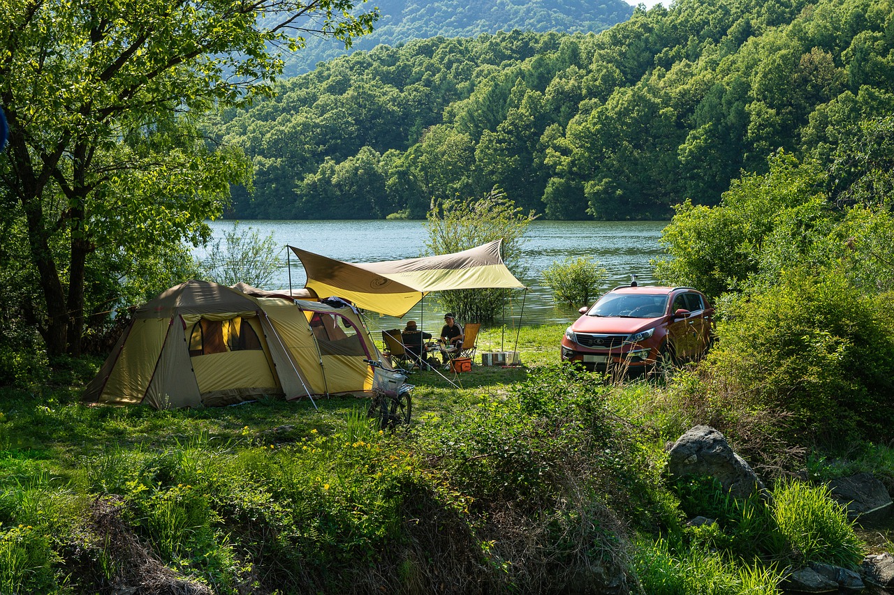 A peaceful campsite at golden hour with a well-maintained tent and clean surroundings