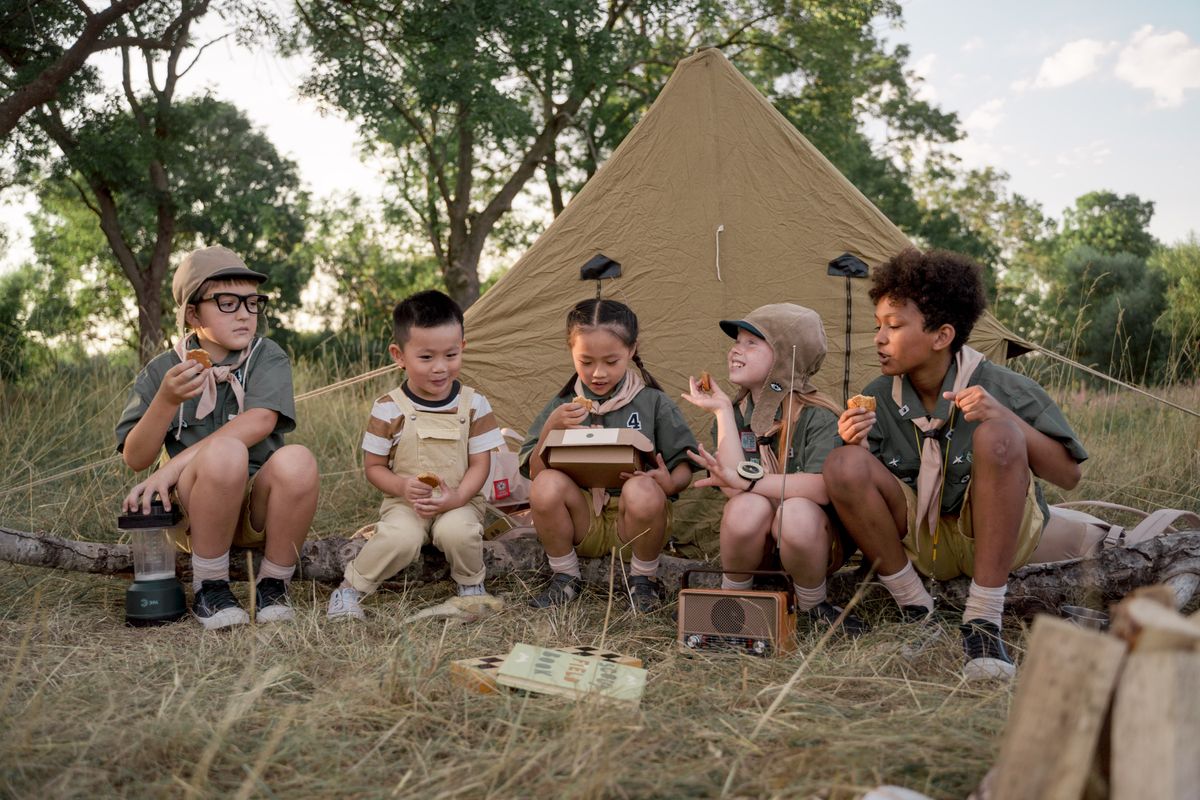 Kids playing outdoor games at a campsite