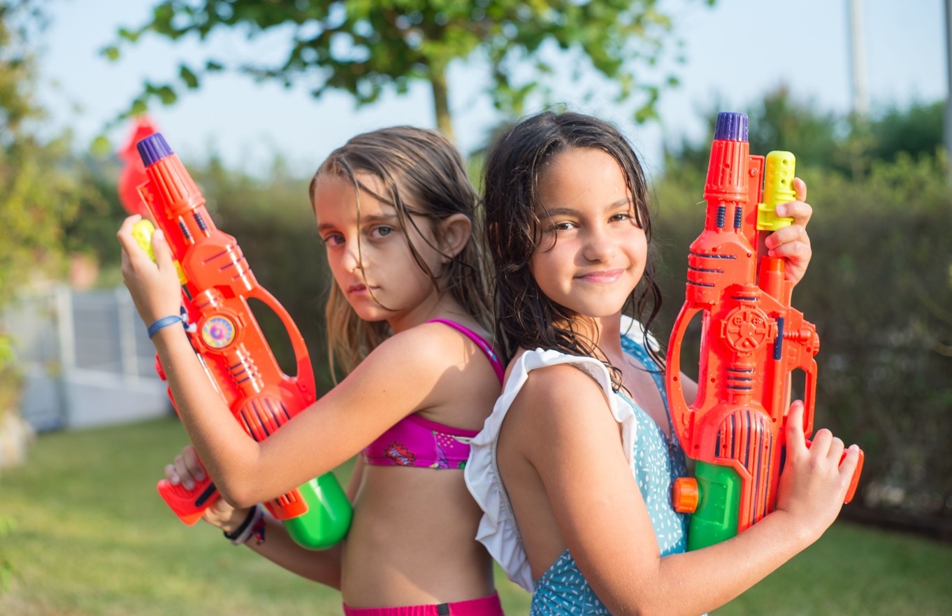 Kids having a water gun fight