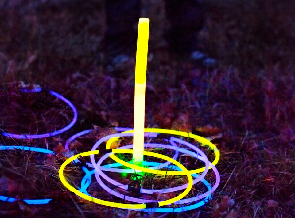Glow stick ring toss game at night