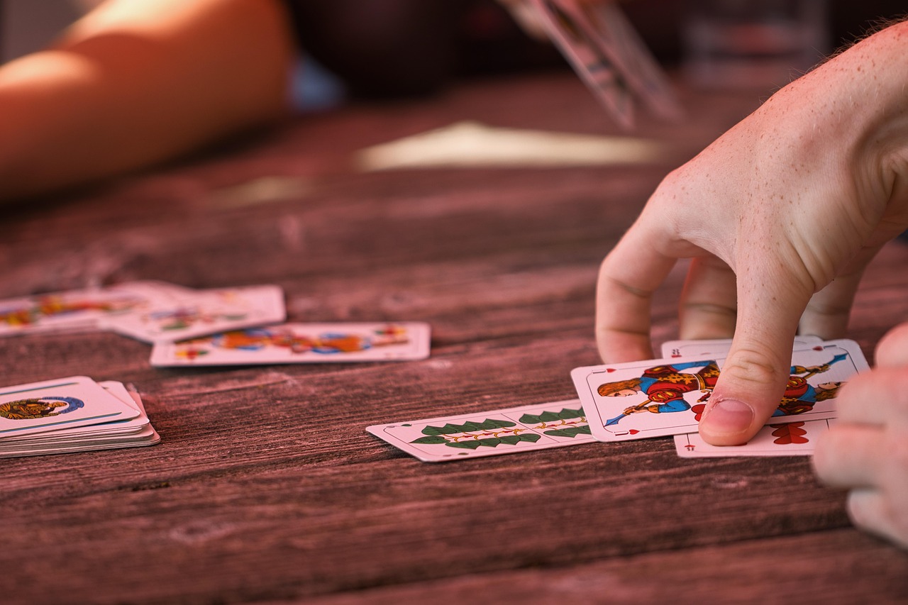 Family playing card games at the campsite