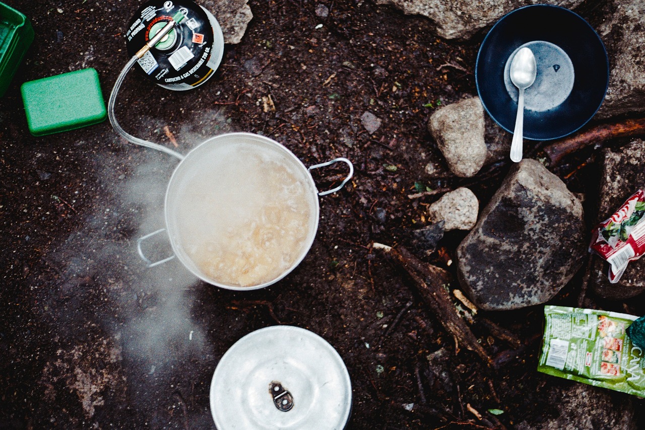 Camp cooking gear laid out on a table
