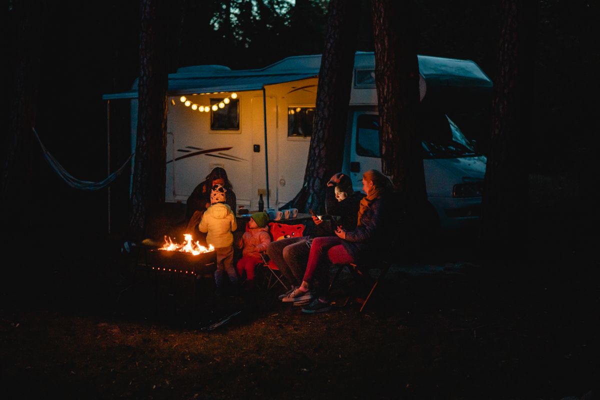 Campsite with campfire at dusk