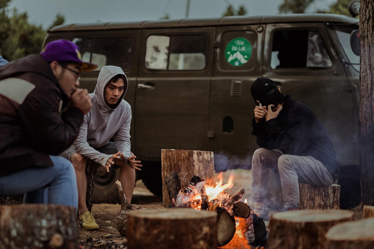 People gathered around a campfire at night