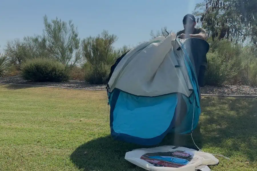 Close-up view of tent poles being collapsed