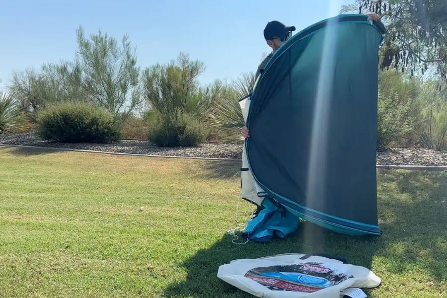 Close-up view of tent poles being collapsed