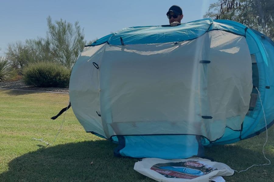 Tent laid flat on the ground ready for folding