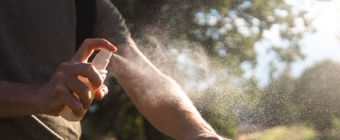 Mosquito repellent spray bottle and treated gear