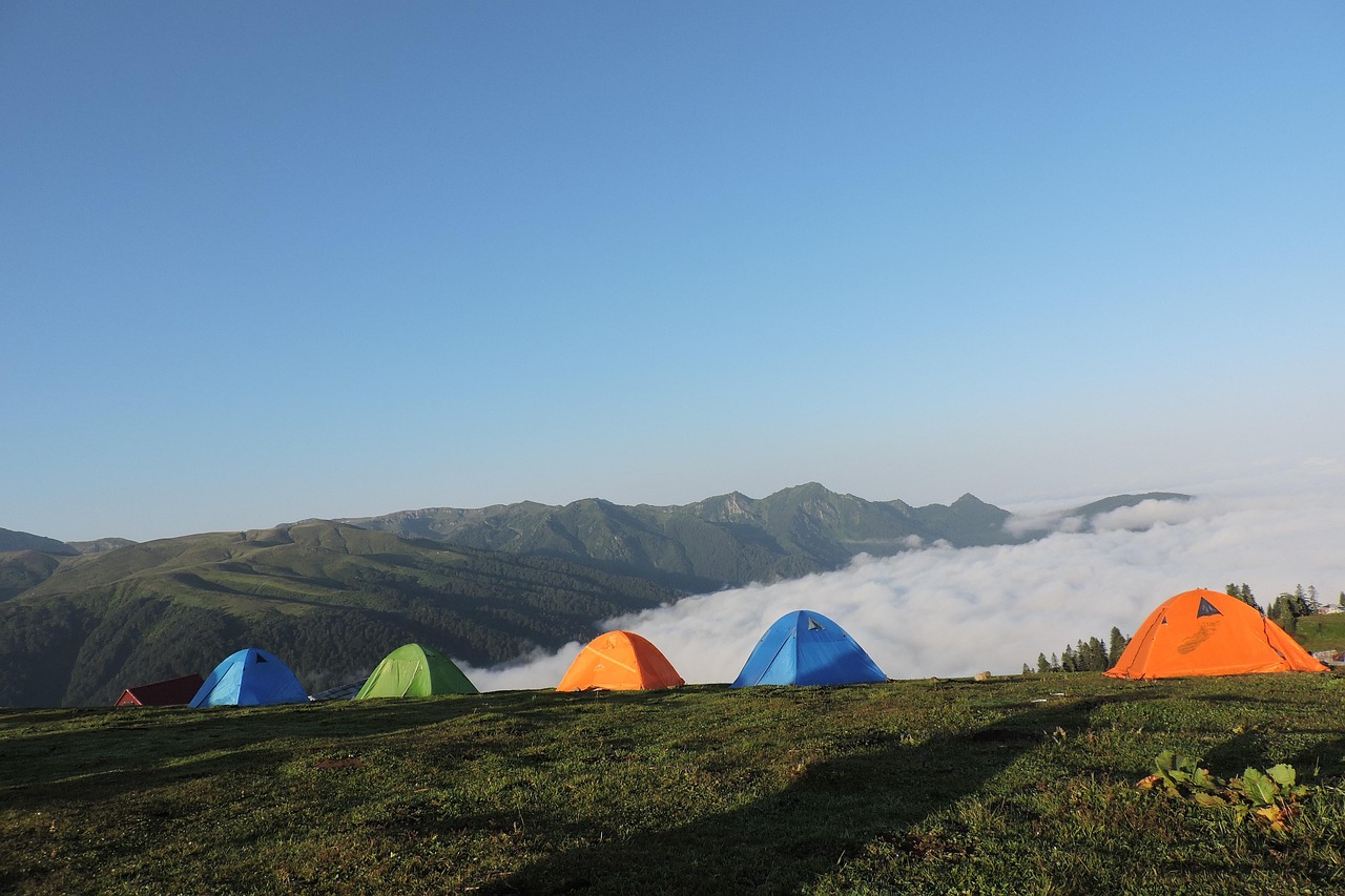 Family camping by the lake with tent
